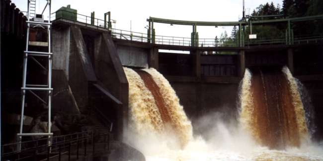 a water flowing out of a dam