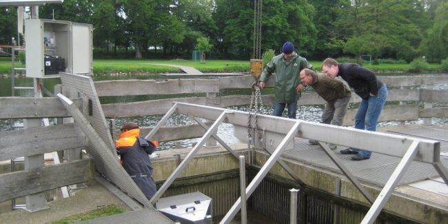a group of men working on a water treatment plant