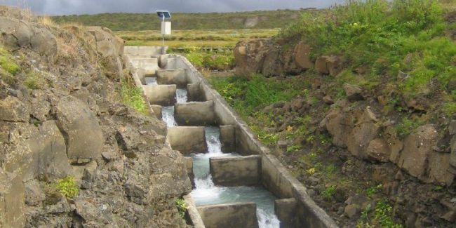 a water flowing through a ditch